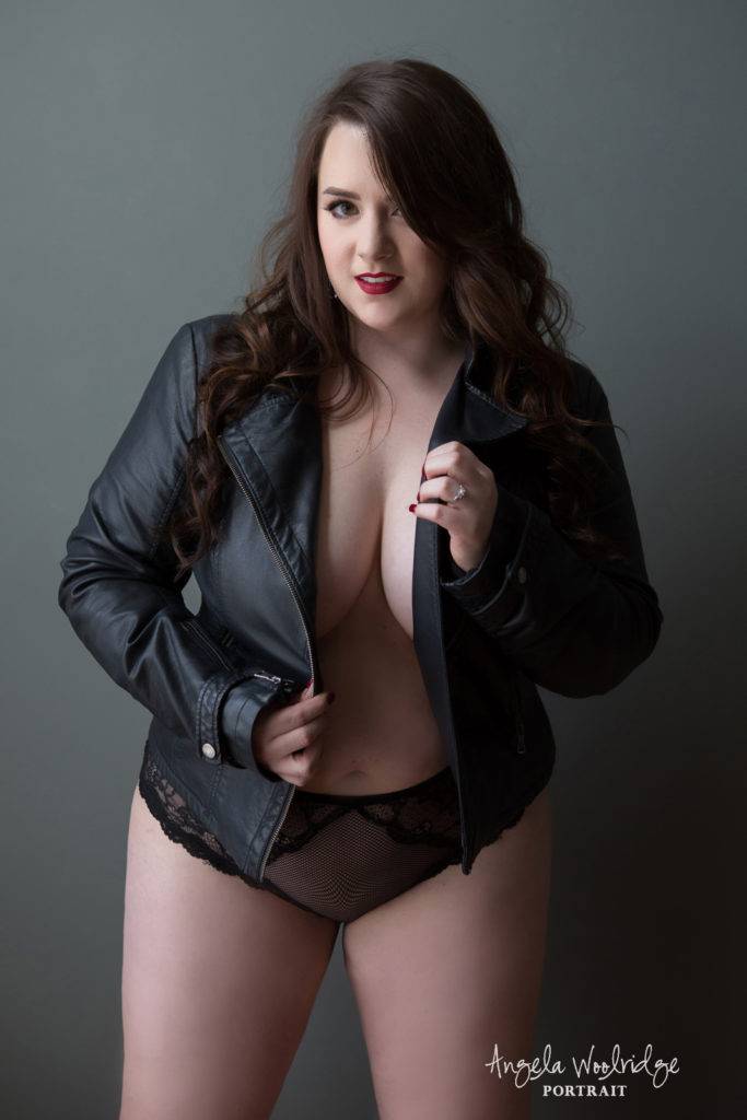 sexy curvy woman in leather jacket, plus size boudoir photo