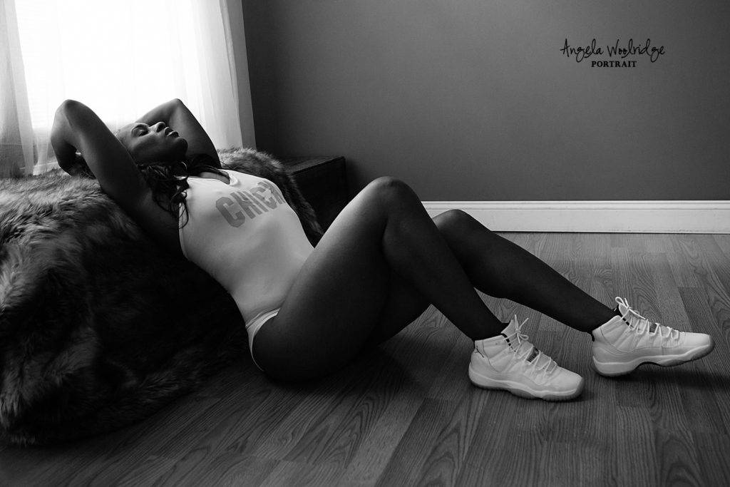 beautiful boudoir photo, black woman reclining on floor