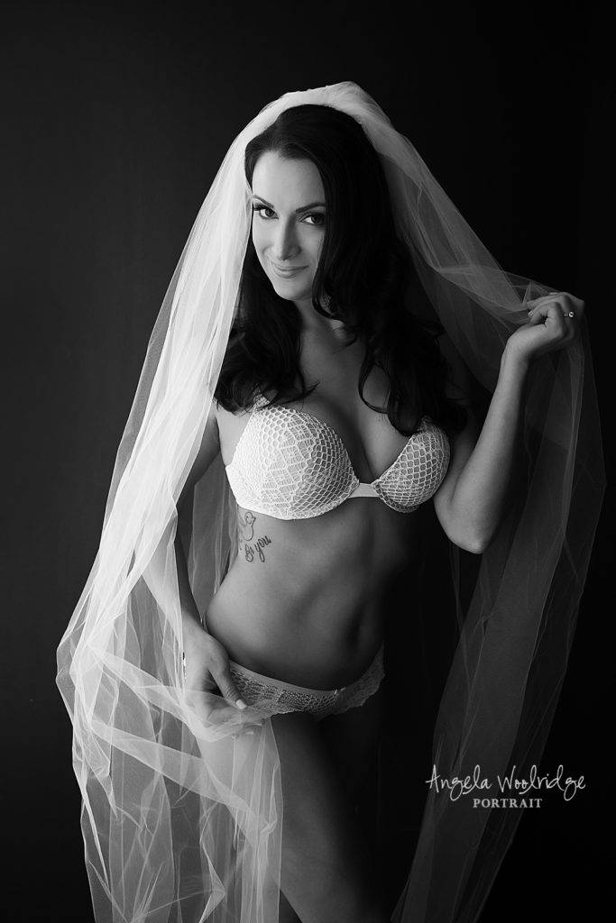 stunning bridal boudoir photography, woman in her lingerie and veil