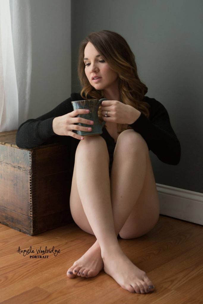Woman relaxing with coffee in Columbus boudoir
