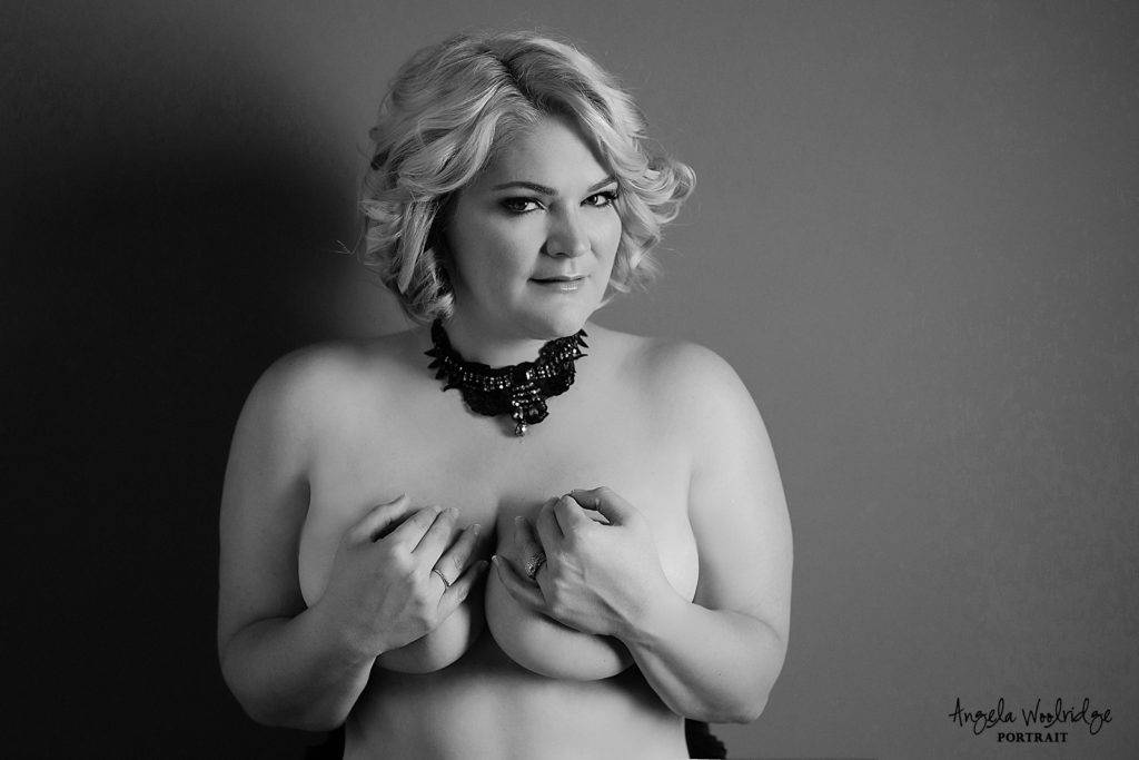 Implied nude in boudoir photography session